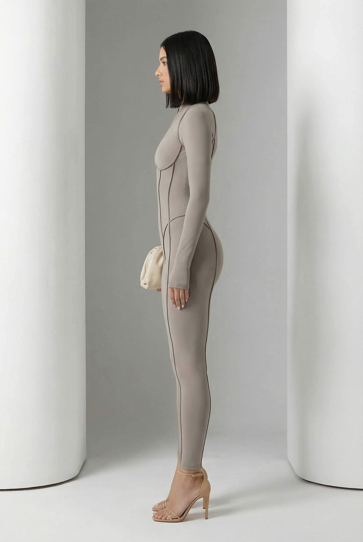 Glacier grey Selene Sculpt Jumpsuit in side profile showing curved contour seams to the ankle