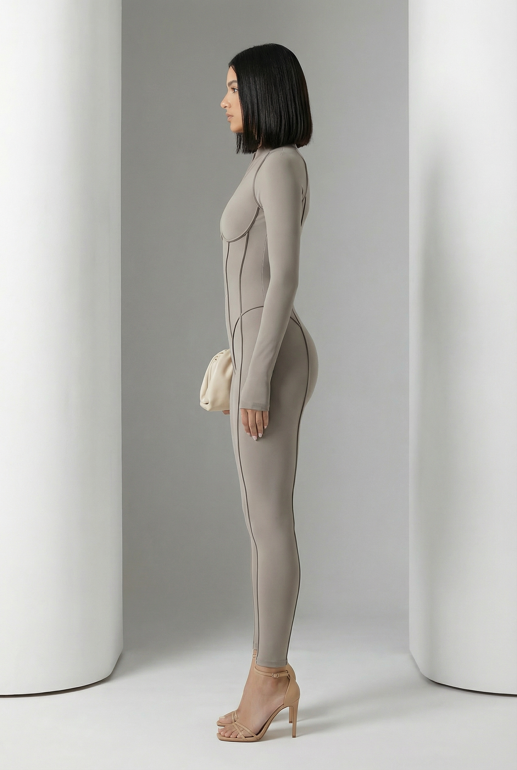 Glacier grey Selene Sculpt Jumpsuit in side profile showing curved contour seams to the ankle