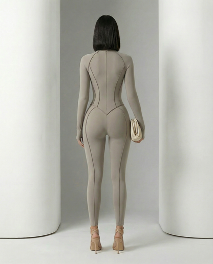 Back view of the glacier grey jumpsuit showing the centre seam and shaped waist panels