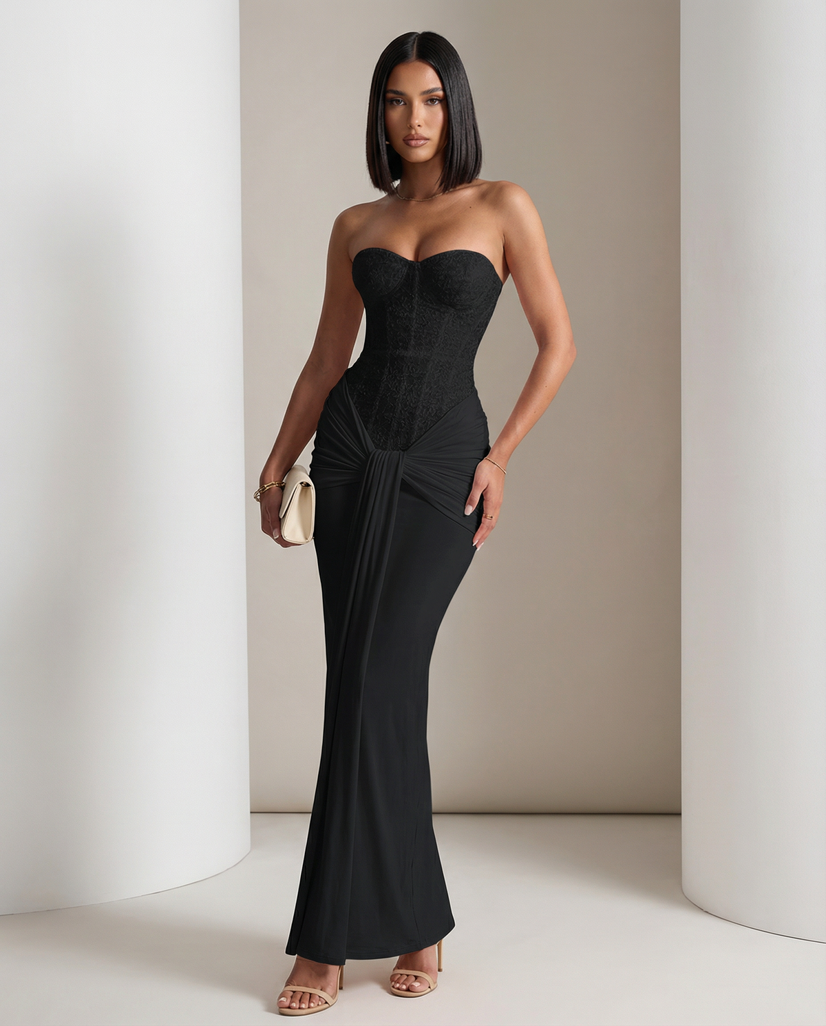 Black Siren Dress with a shimmering strapless corset bodice and draped skirt, full length front view