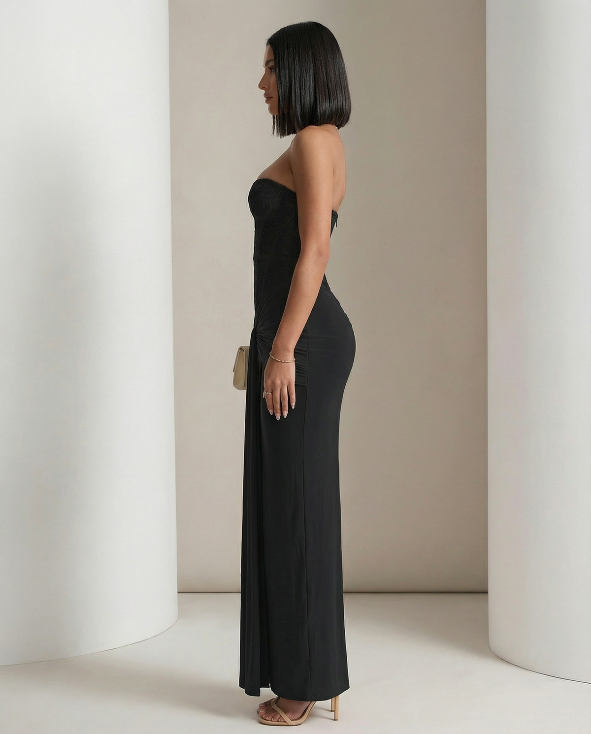 Black Siren Dress from the side, fitted corset bodice into a floor-length ruched column, side view