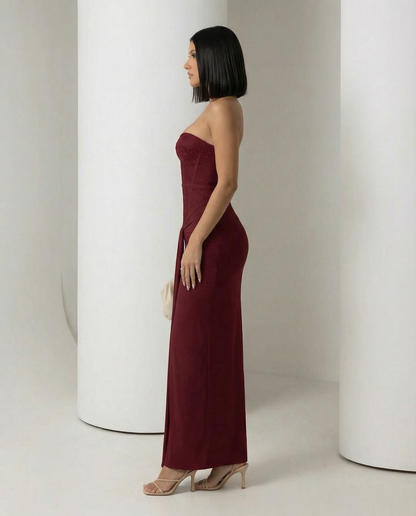 Burgundy Siren Dress seen from the side, boned corset bodice over a floor-sweeping column skirt