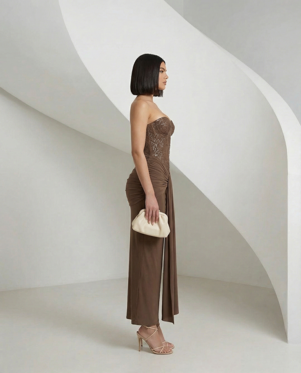Mocha brown Tundra Siren Dress seen from the side, corset bodice and long draped panel, full length