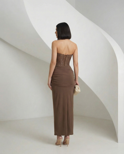 Mocha brown corset gown from behind, laced back panel above a ruched skirt, full length back view