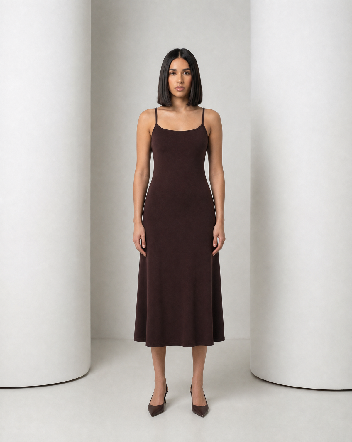 The Siv midi slip dress in espresso, front view, narrow straps and a soft A-line skirt