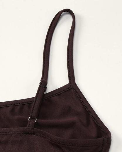 Construction detail of the Siv slip dress, the narrow self-fabric strap and its metal slider