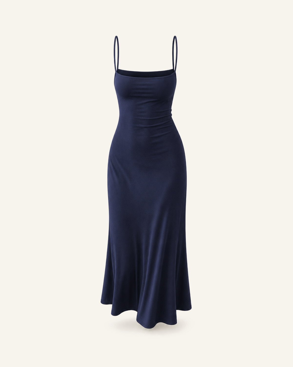 The Siv midi slip dress in navy, narrow straps, straight neckline and a fluted hem, alone on a bone background