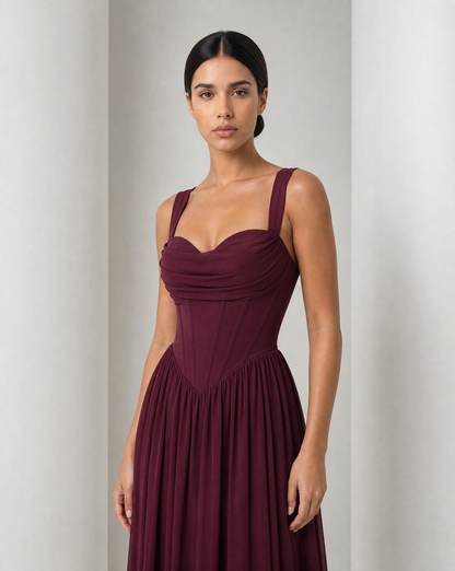 Draped cowl neckline and panelled corset bodice of the Solveig gown in burgundy