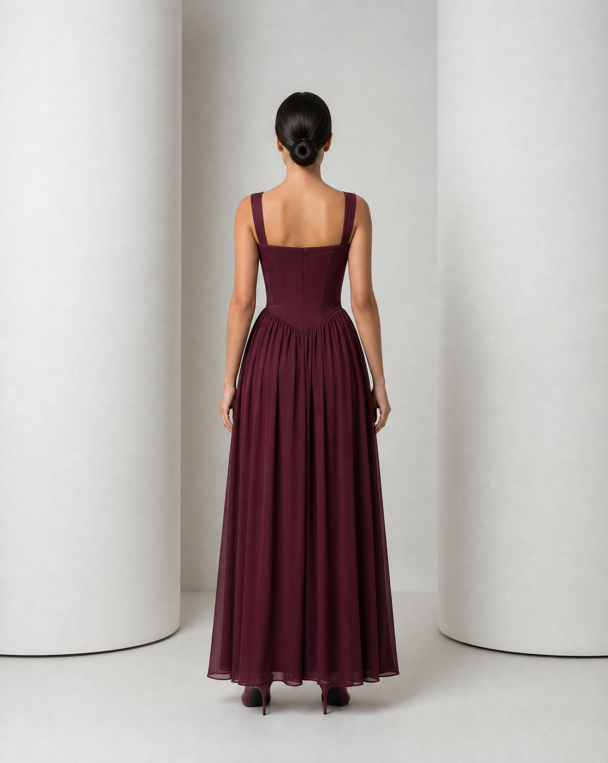 Back of the Solveig burgundy gown, showing the panelled corset and gathered skirt