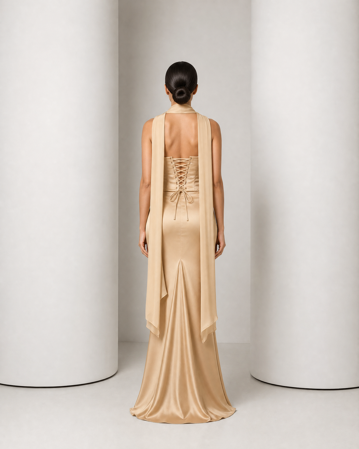 Back of the Sorrel champagne corset, laced with a fabric cord and tied in a soft bow