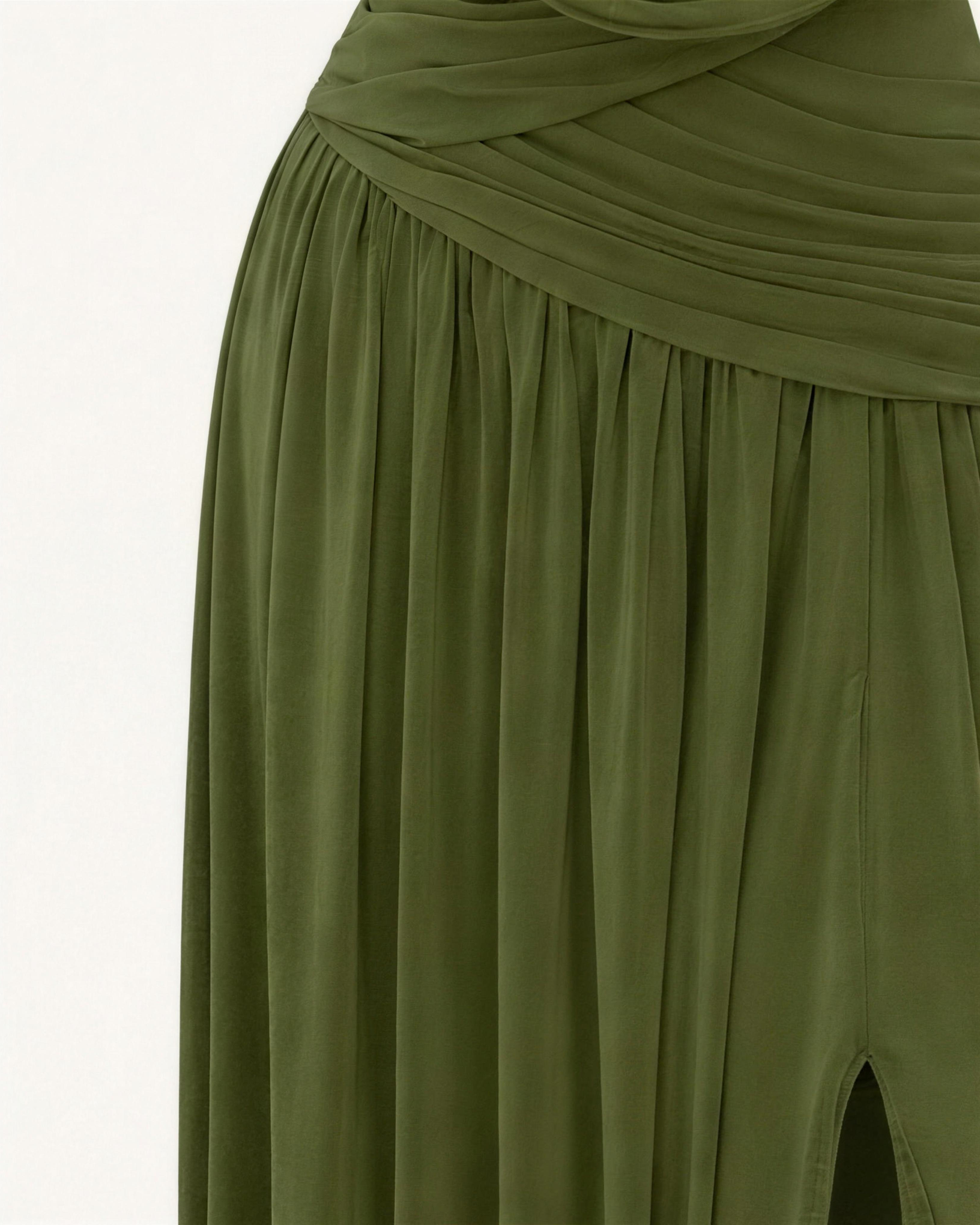 Macro of the Thora dropped waist seam, fine gathers falling away below the ruched hip