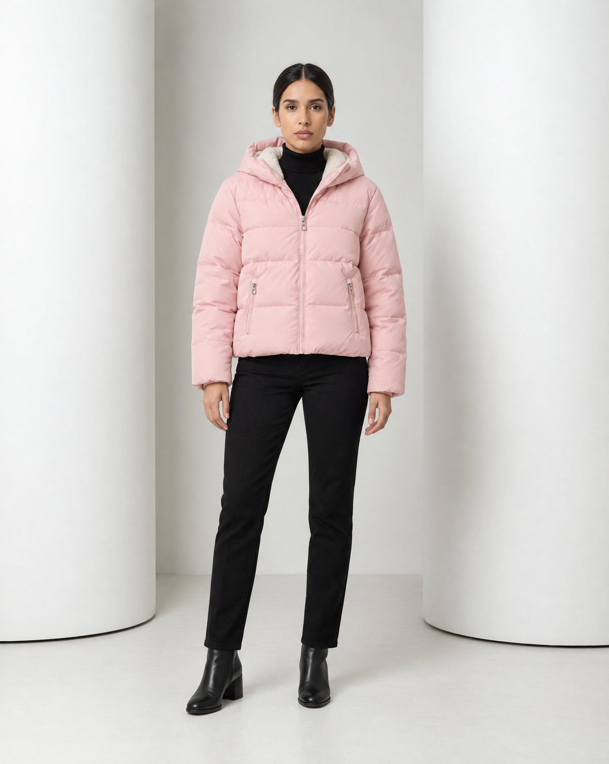 Tove hooded puffer jacket in pink, full-length front view worn over black trousers