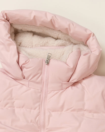 Detail of the Tove puffer hood lined in soft cream teddy fleece, front zip below