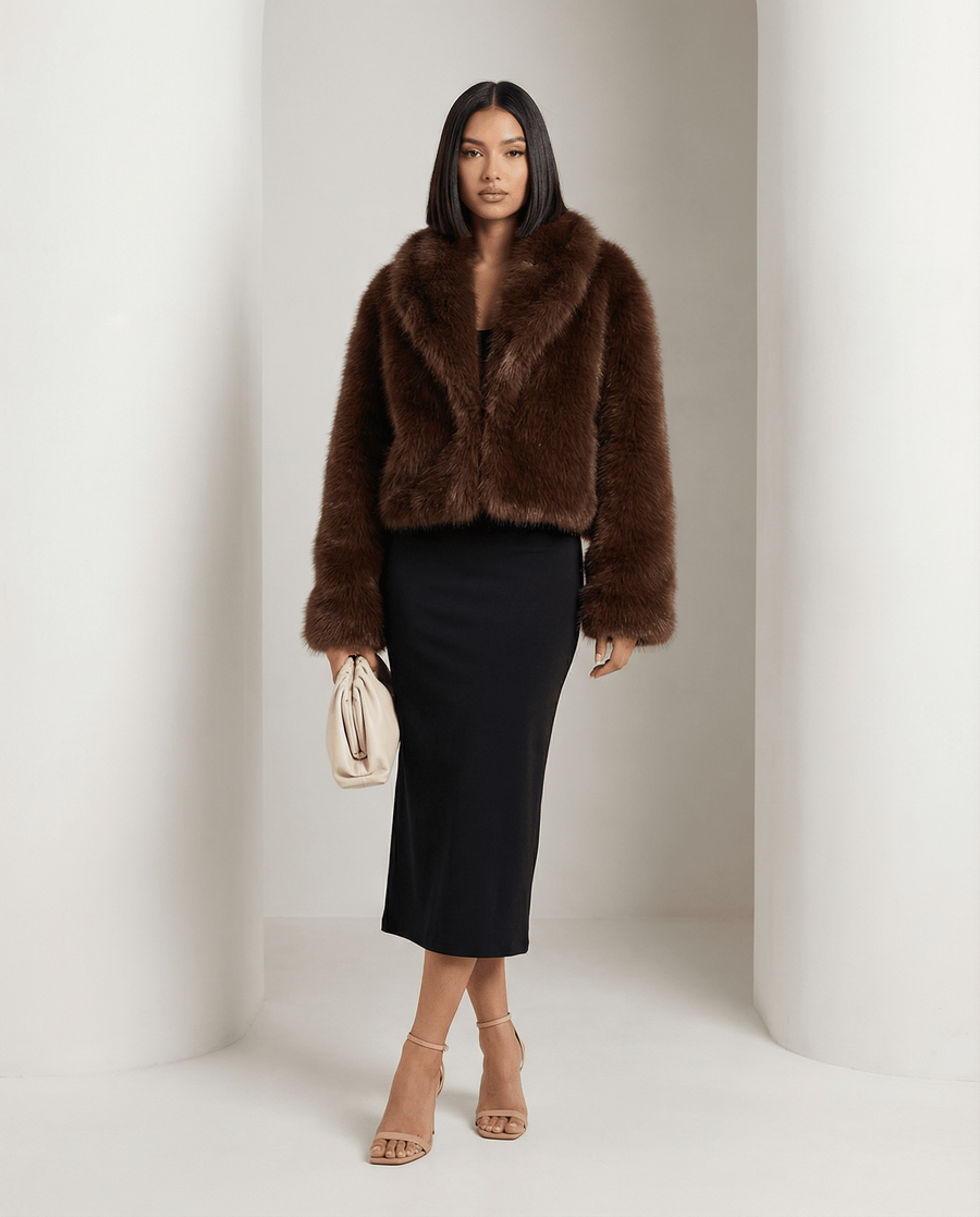 Cocoa brown cropped Vera faux-fur jacket worn open over a black midi skirt, full length front view