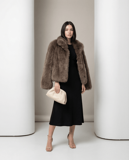 Cropped taupe faux-fur jacket with a wide collar and full sleeves over a black midi dress