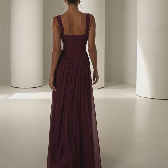 Solveig burgundy corset gown, model walking and turning to camera