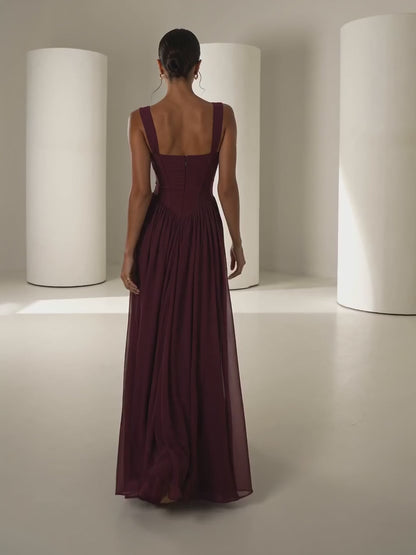 Solveig burgundy corset gown, model walking and turning to camera