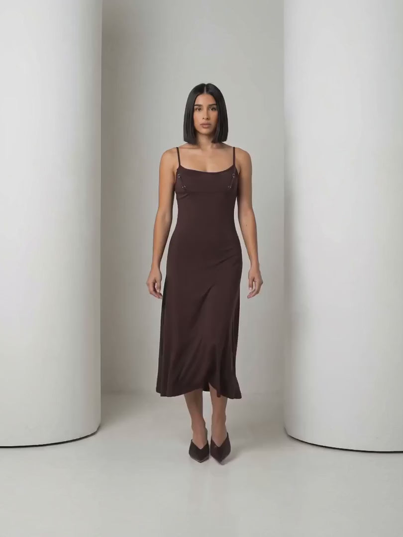 Short clip of the Siv espresso midi slip dress walking and turning to show the back