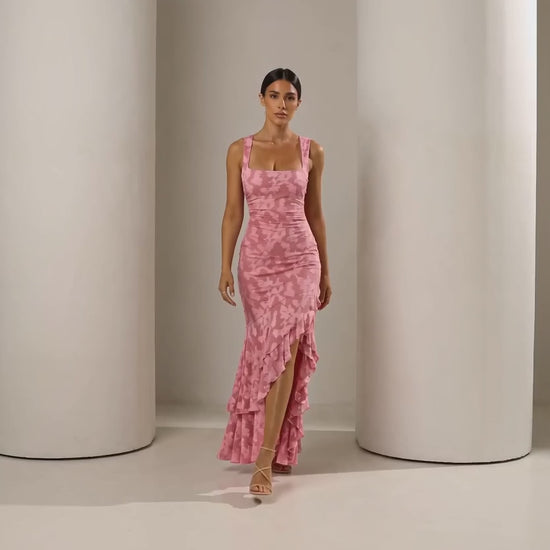 Short clip of the Ilva rose ruffle mermaid maxi walking and turning to show the back