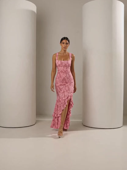Short clip of the Ilva rose ruffle mermaid maxi walking and turning to show the back