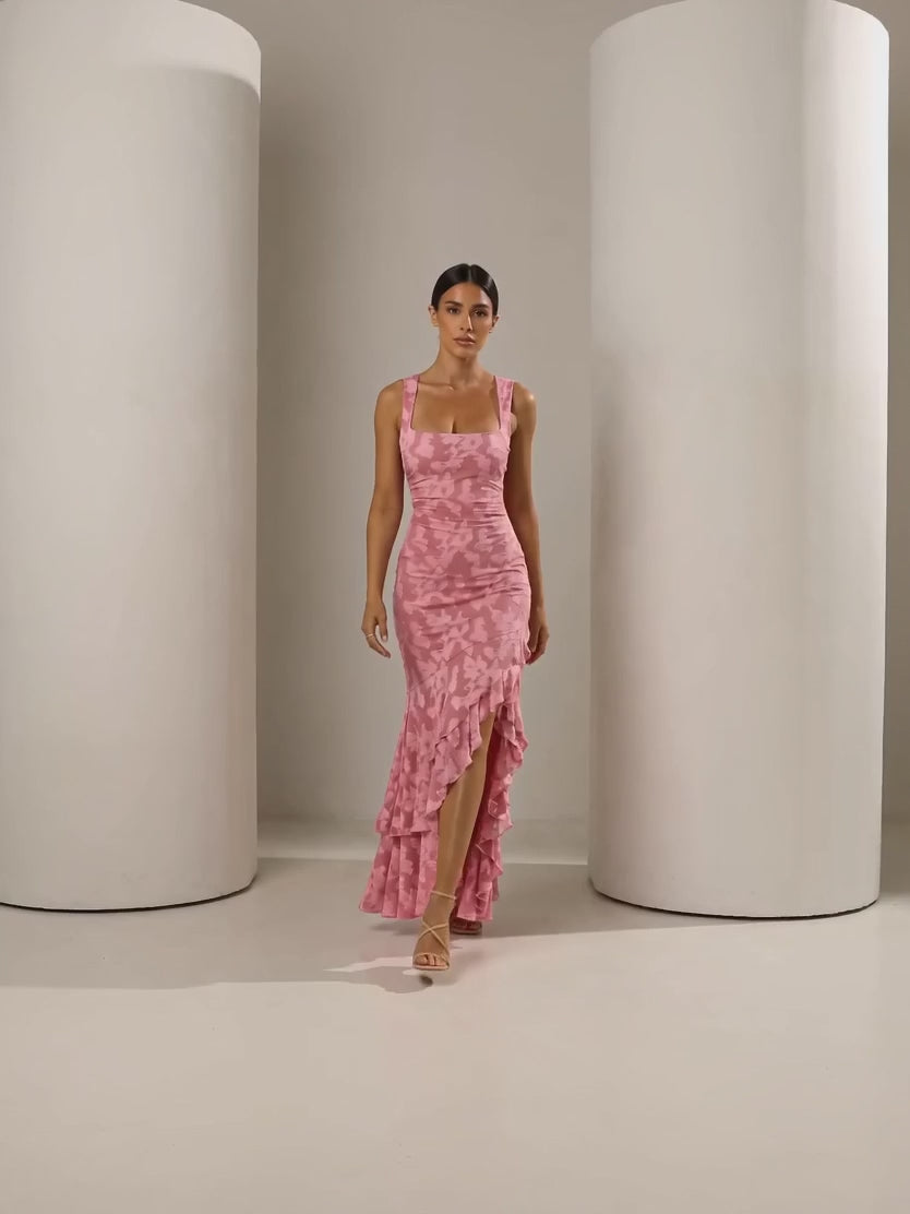 Short clip of the Ilva rose ruffle mermaid maxi walking and turning to show the back